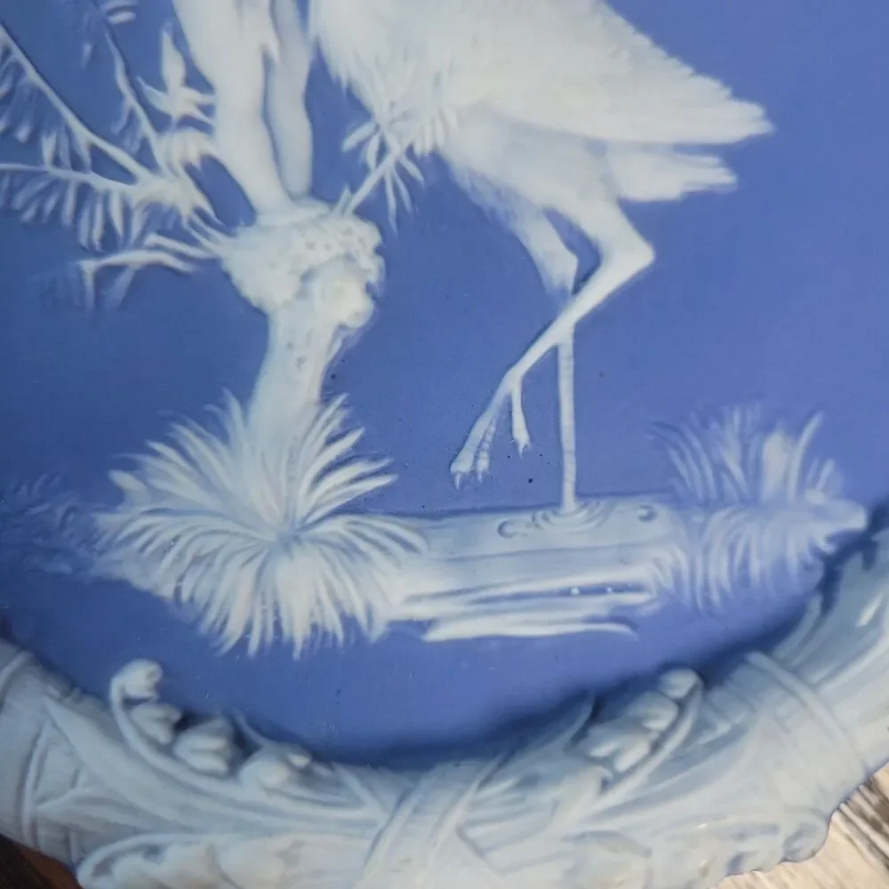 Schafer & Vater Blue & White Jasperware Plaque Featuring a Cherub & Stork Lily